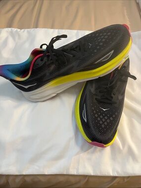 Hoka Clifton 9 Black Running Shoes with Yellow Midsole and Rainbow Lining